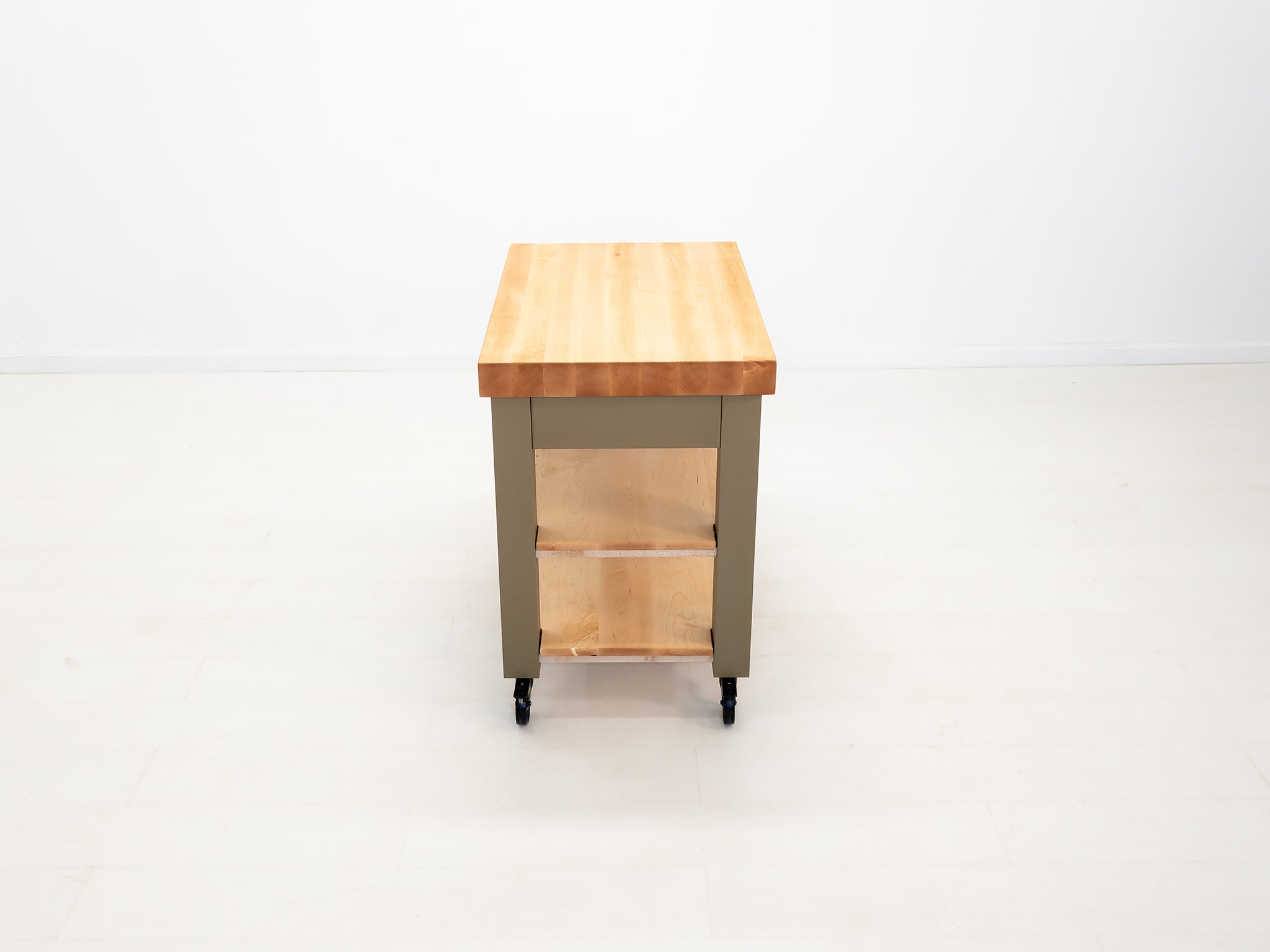 CHEF kitchen cart with solid wood top and utility storage.