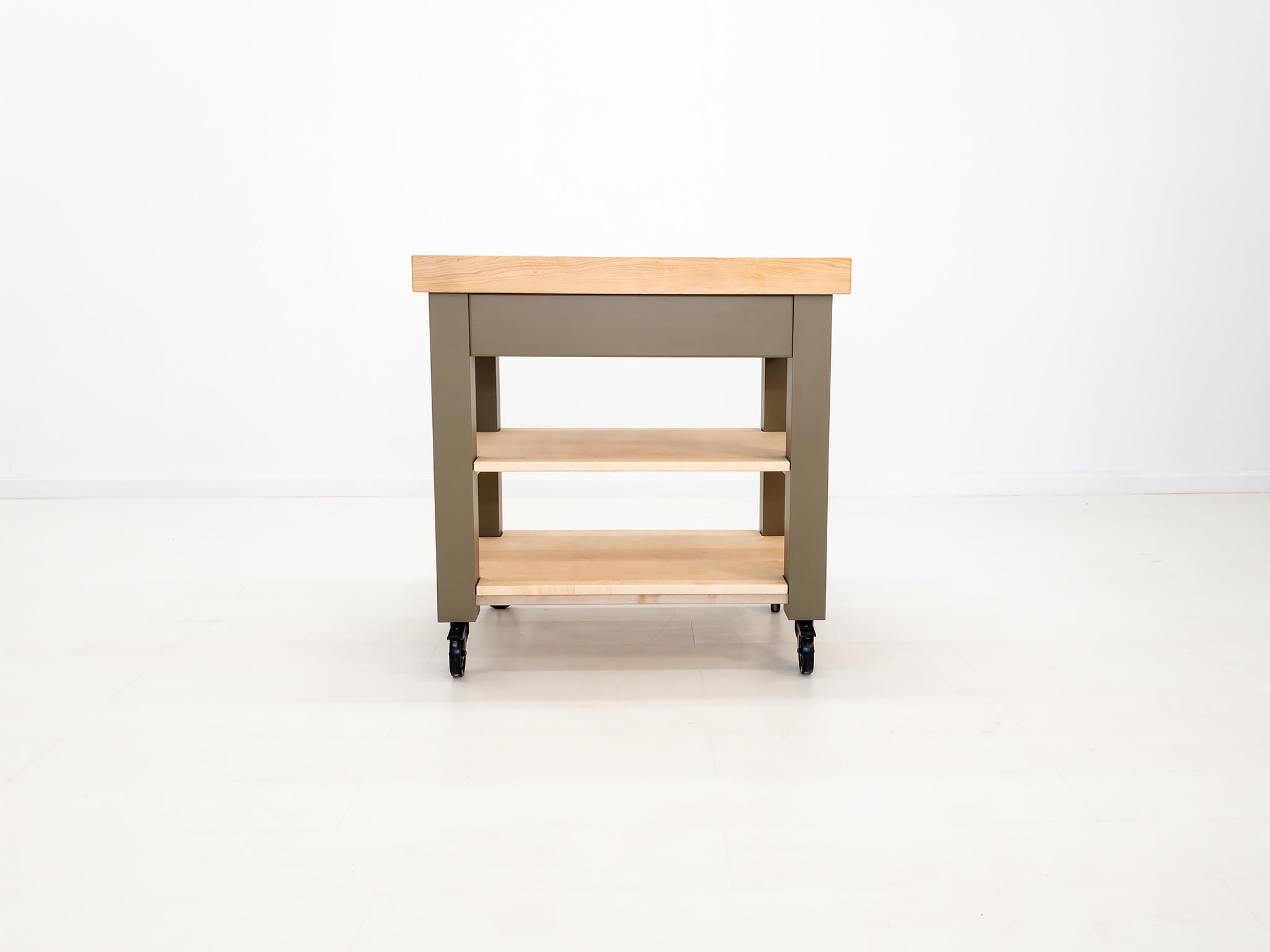 CHEF kitchen cart with solid wood top and utility storage.