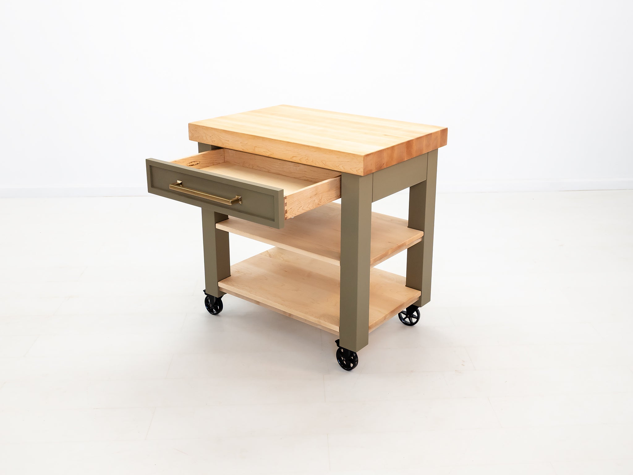 CHEF kitchen cart with solid wood top and utility storage.
