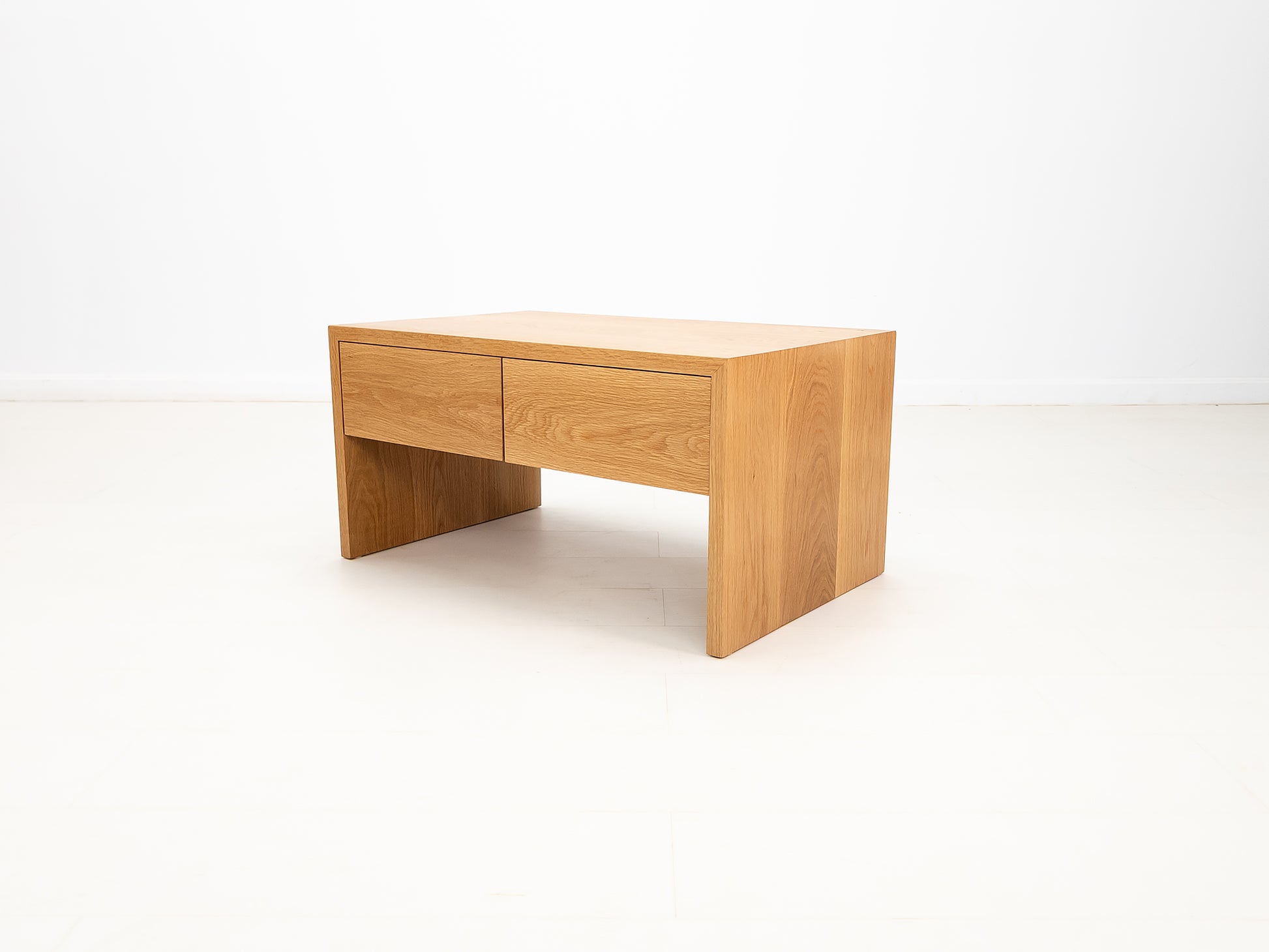 Side profile of DREW coffee table in solid white oak.