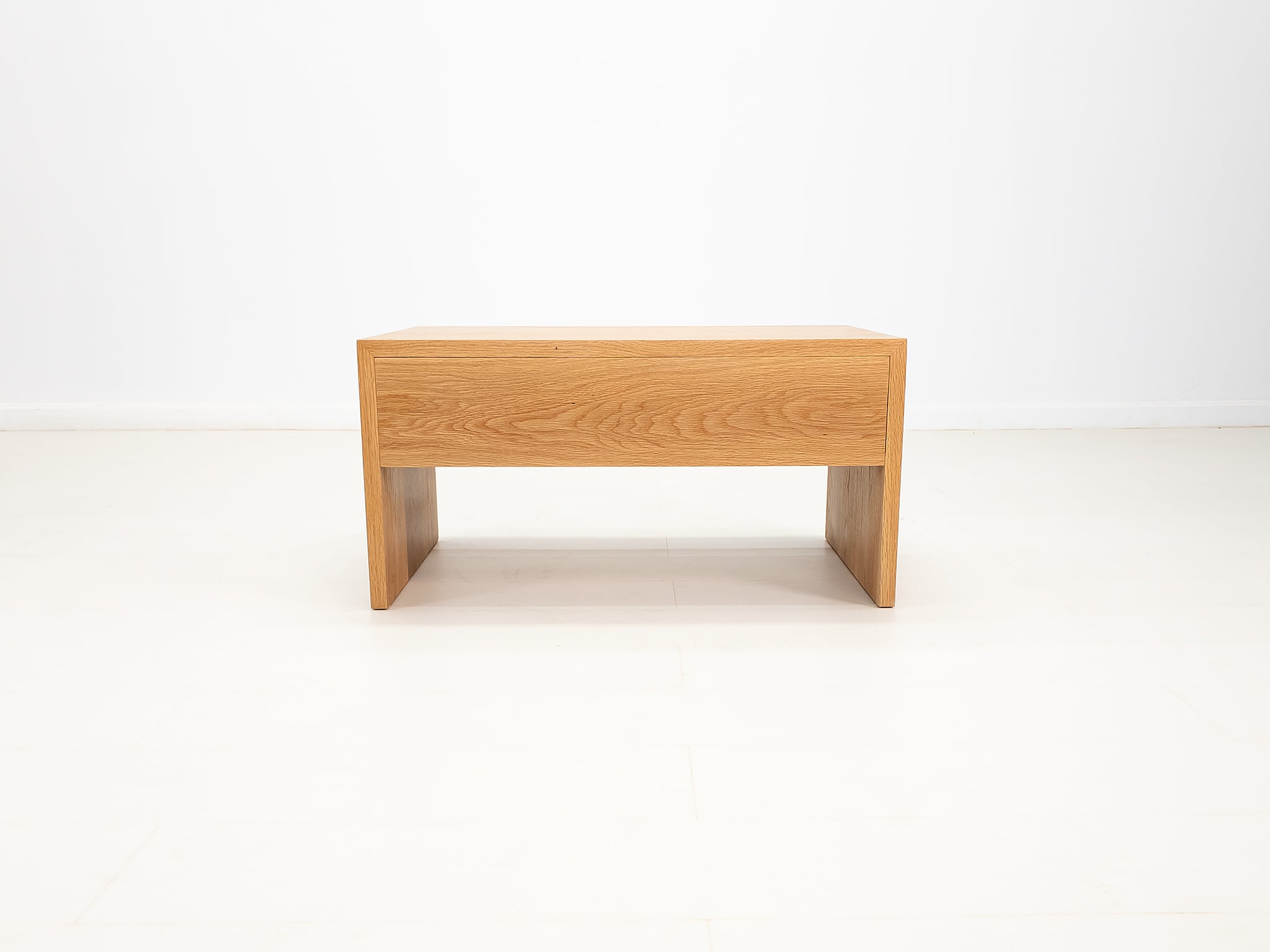 Side profile of DREW coffee table in solid white oak.