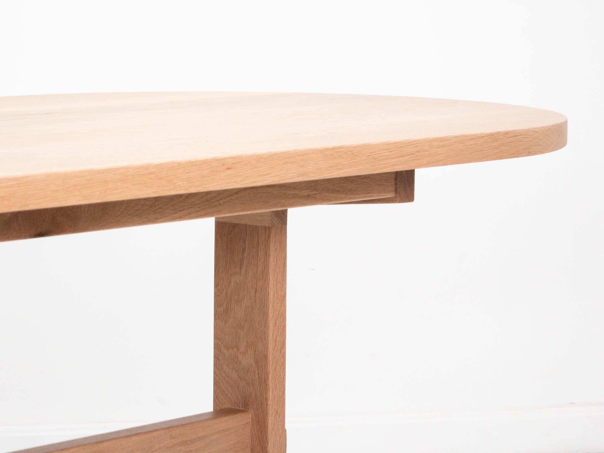 Close-up of BANQ table edge detail in natural white oak.