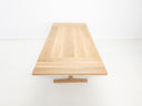 BRIT trestle dining table in natural white oak, shown with beveled edge top.