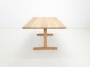 BRIT trestle dining table in natural white oak, shown with beveled edge top.