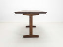 Close-up of beveled walnut tabletop with smooth, hand-finished edge.