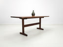 Close-up of beveled walnut tabletop with smooth, hand-finished edge.