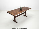 Close-up of beveled walnut tabletop with smooth, hand-finished edge.