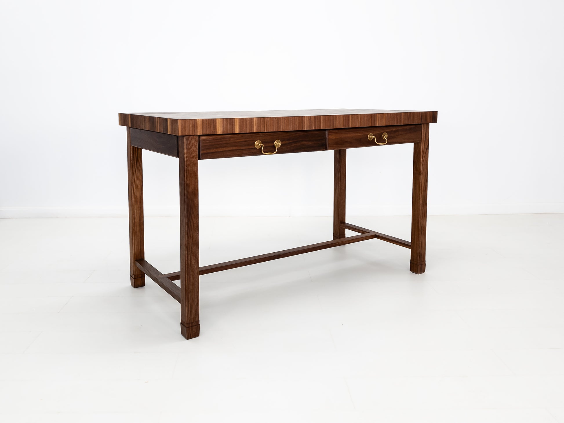 CAMI island with traditional brass pulls and handcrafted end-grain surface.
