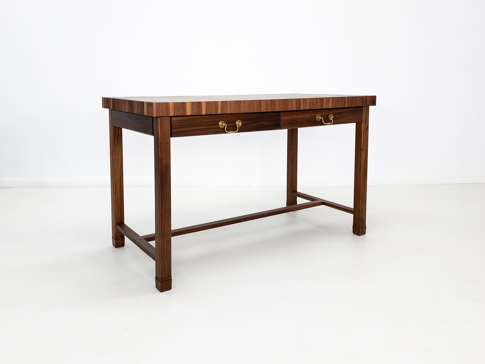 CAMI island with traditional brass pulls and handcrafted end-grain surface.
