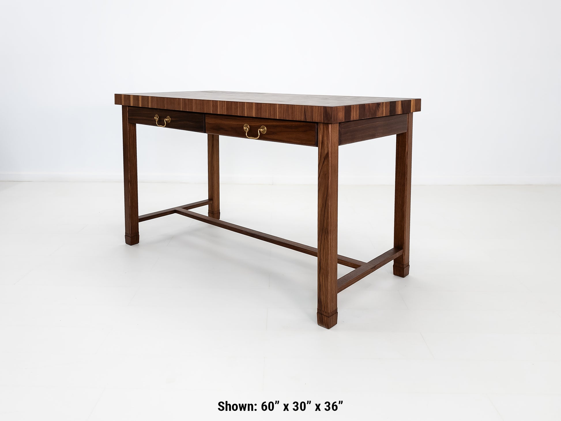 CAMI butcher block island in solid walnut with end-grain top and stretcher base.