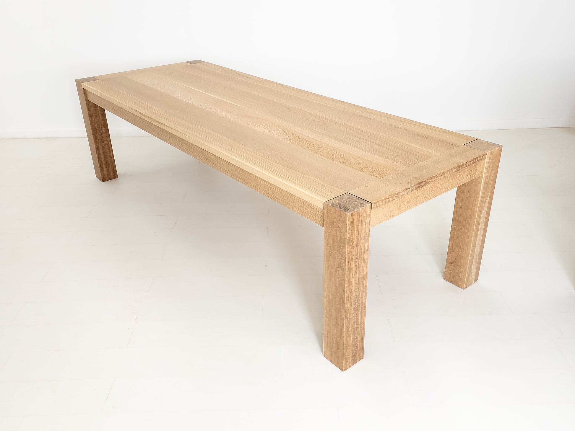 Custom JAQI table in seawashed white oak, Parsons-style base.