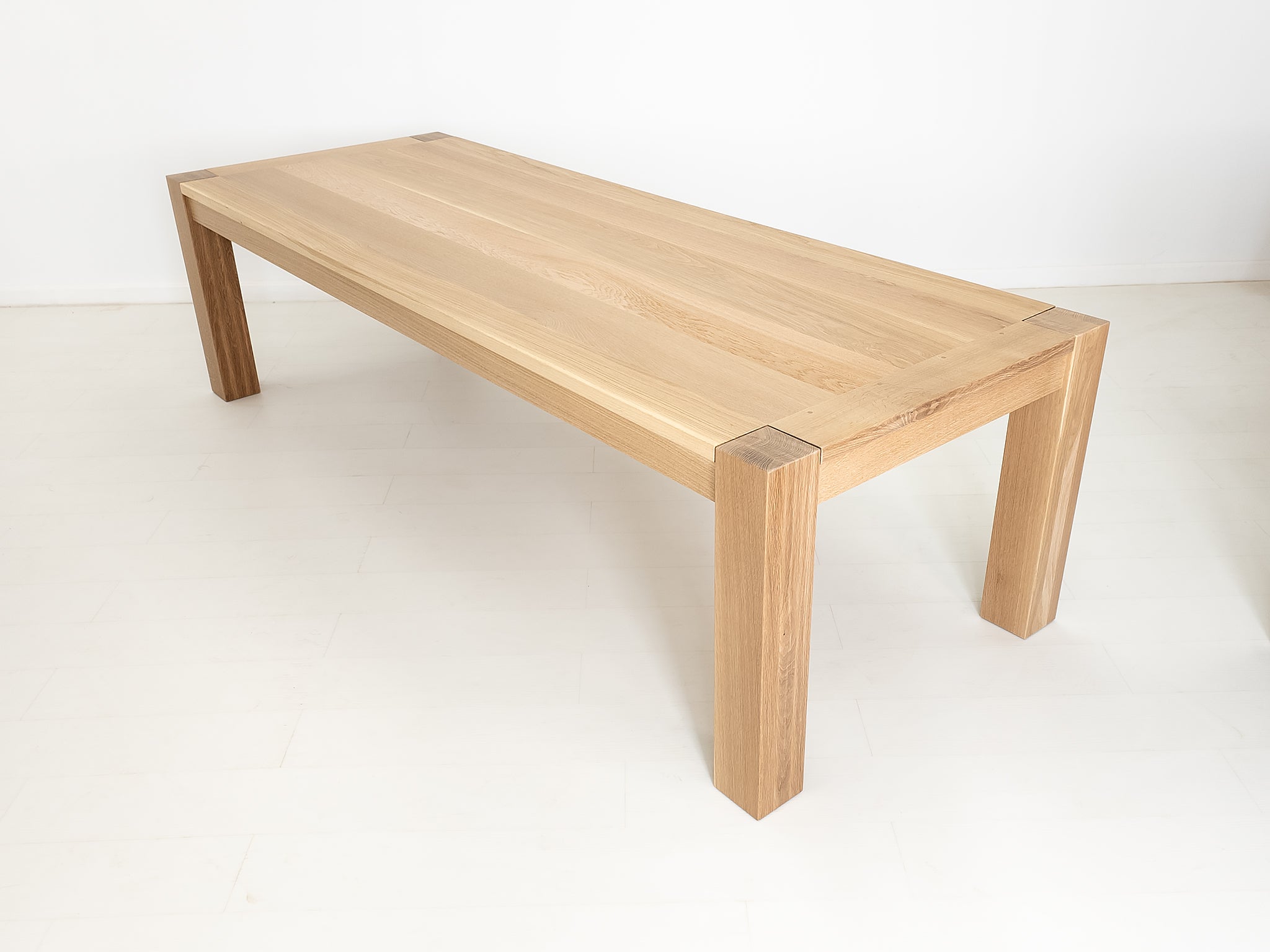 Custom JAQI table in seawashed white oak, Parsons-style base.