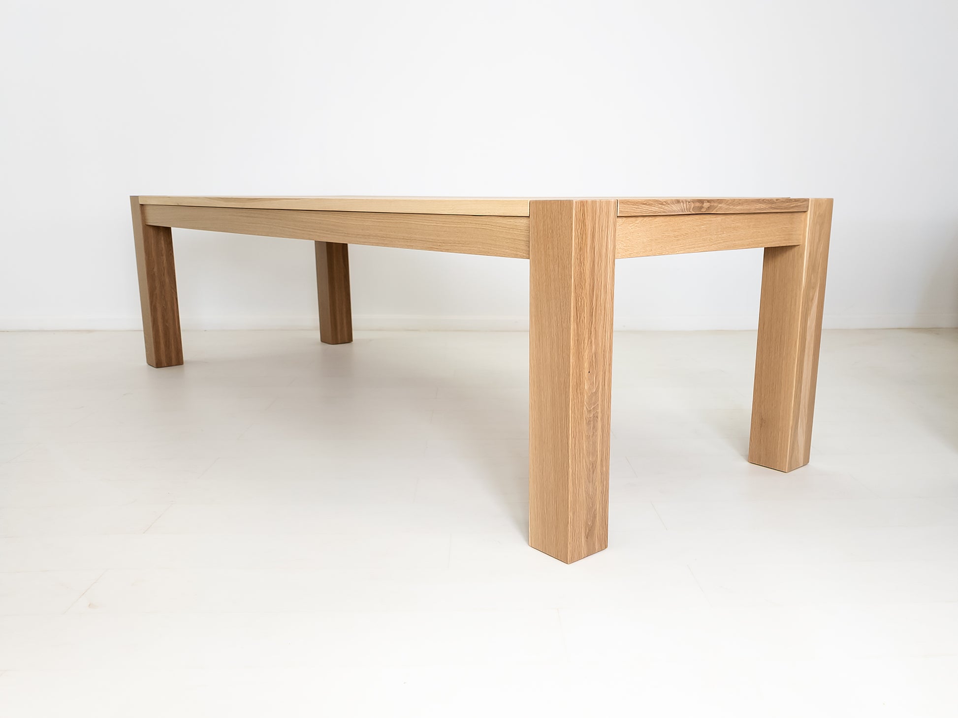Custom JAQI table in seawashed white oak, Parsons-style base.