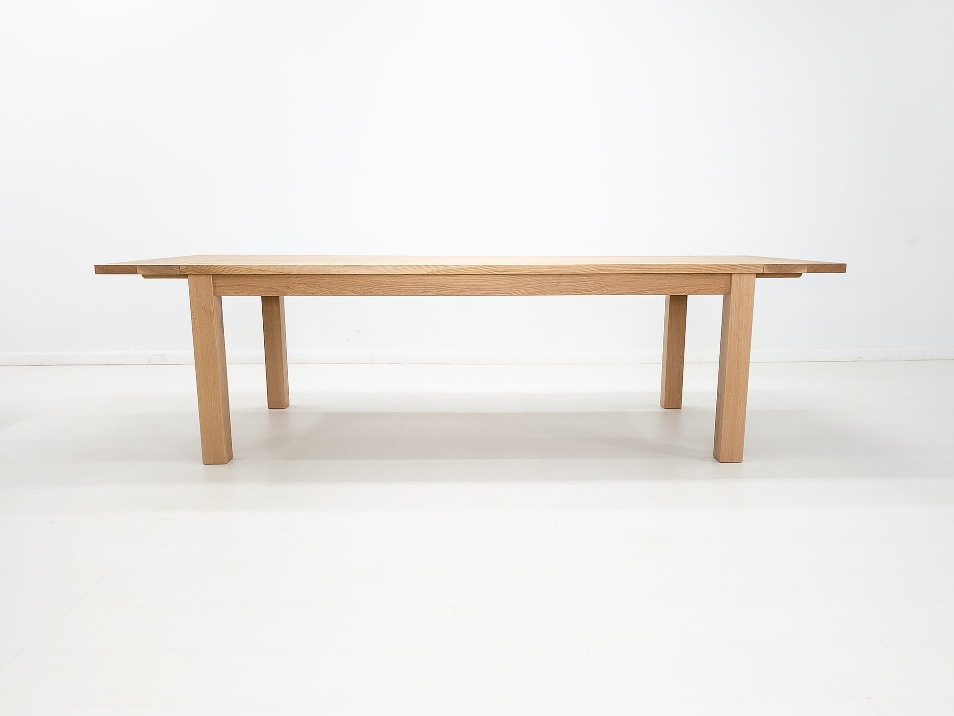 JONA dining table in solid American hardwood, side view.