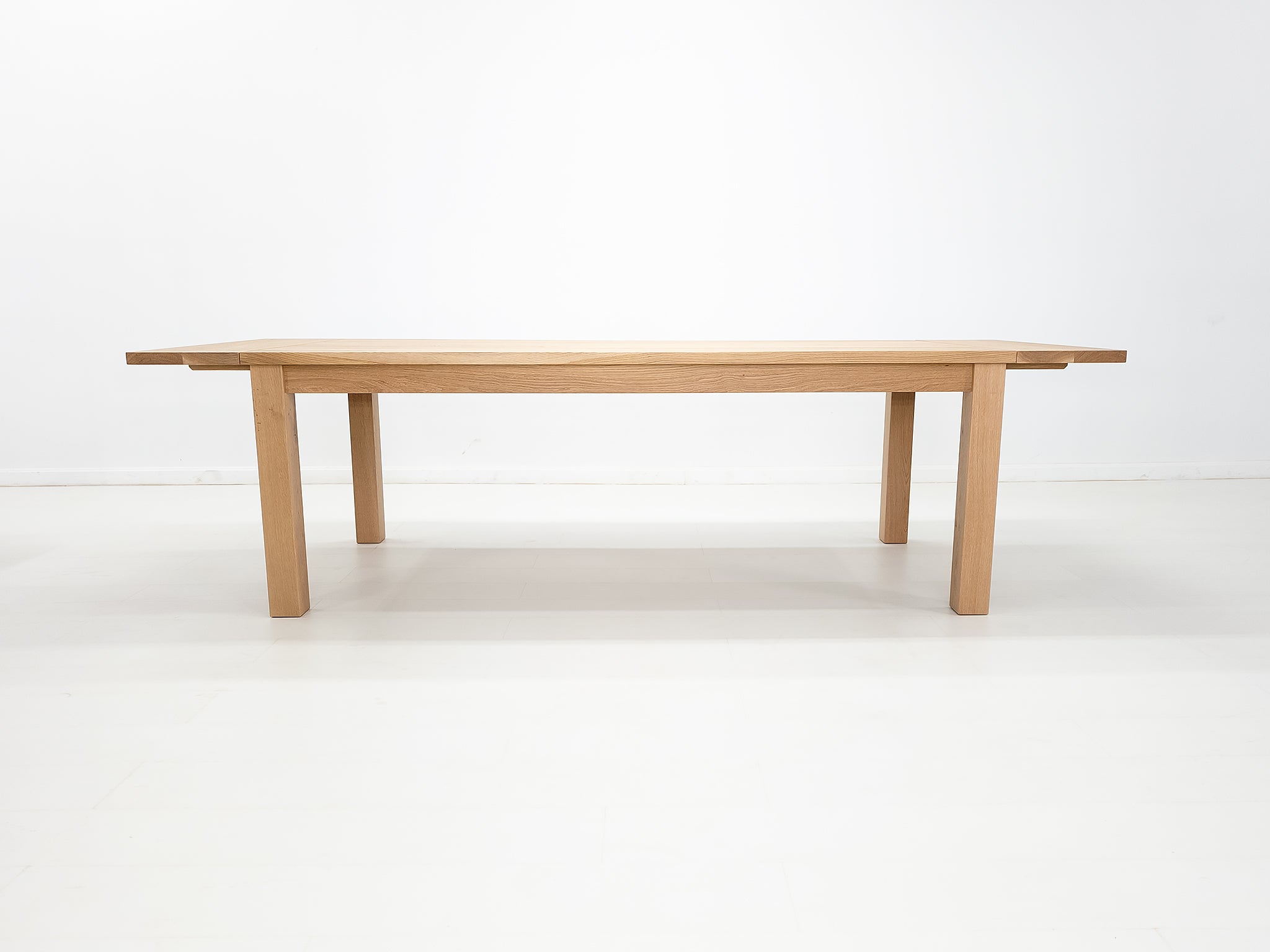 JONA dining table in solid American hardwood, side view.