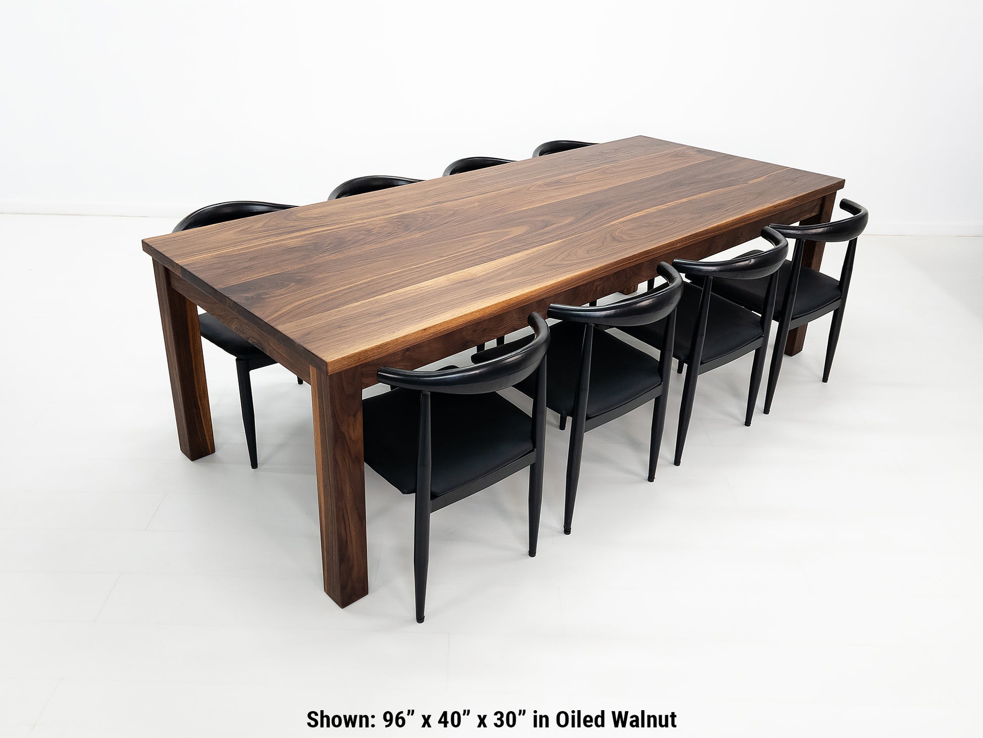 JONA dining table in oiled walnut with square legs.