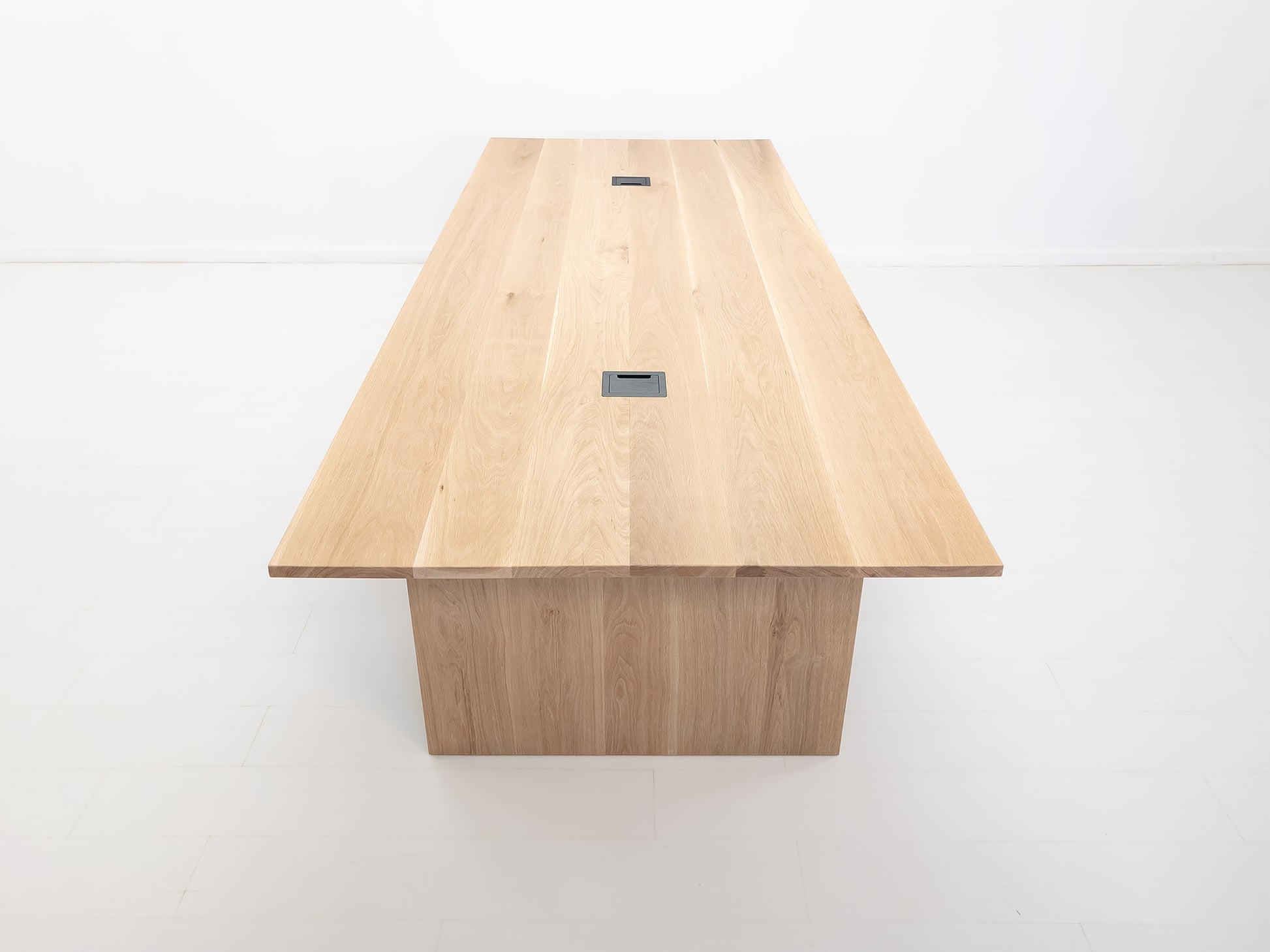 Lily dining table in natural white oak with 1-inch thick top and clean plank grain.
