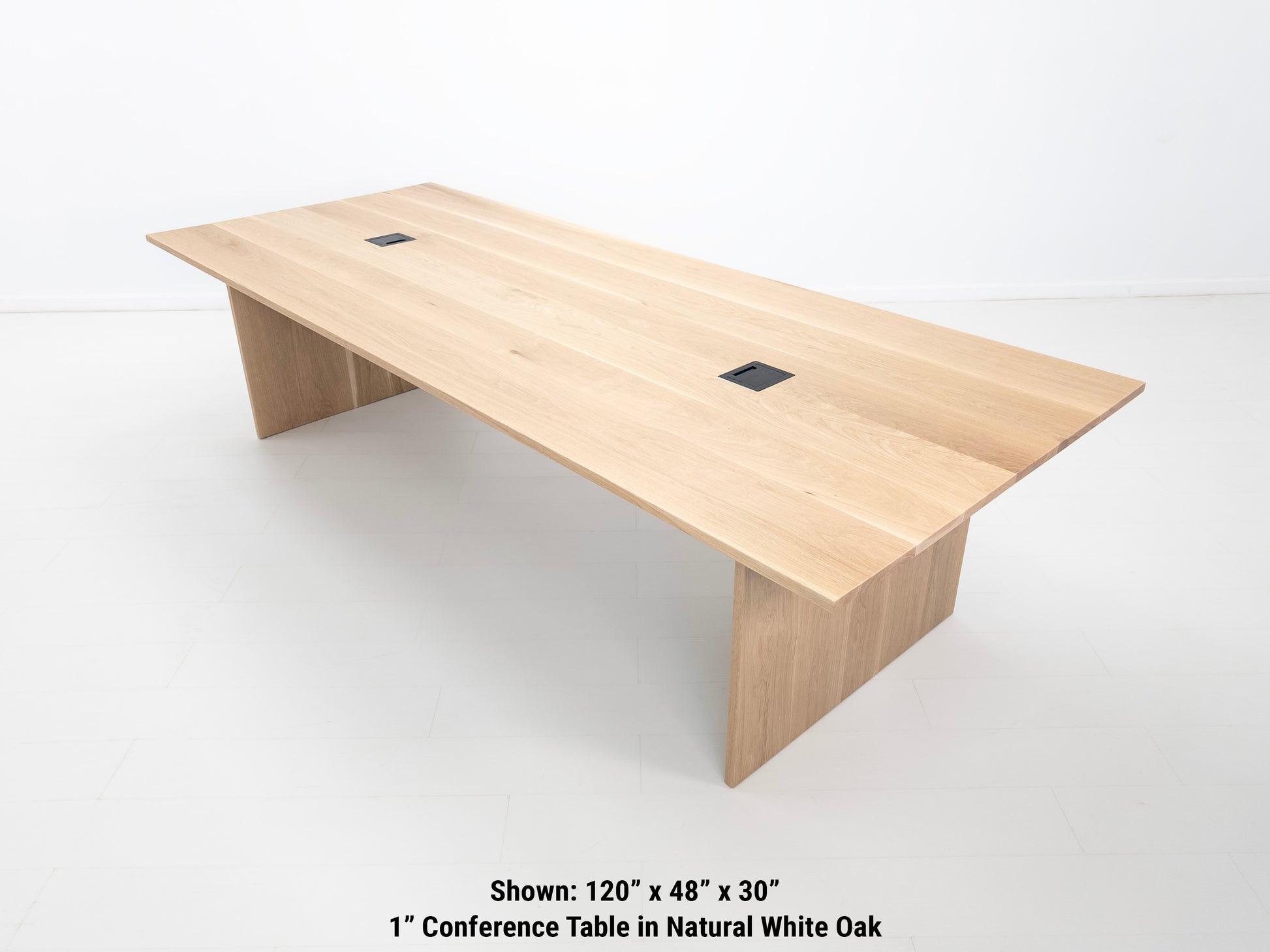 Lily dining table in natural white oak with 1-inch thick top and clean plank grain.