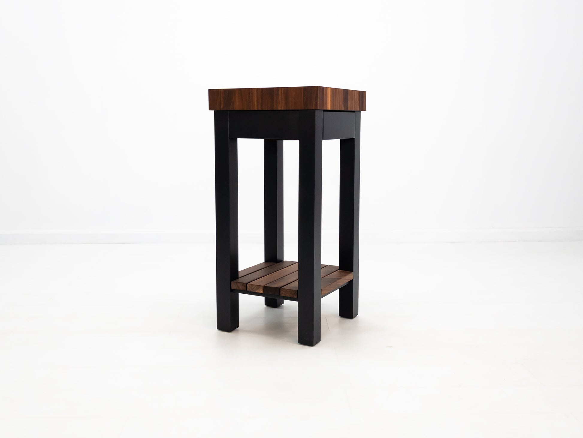 Custom LUCA island with painted base and slatted walnut shelf.