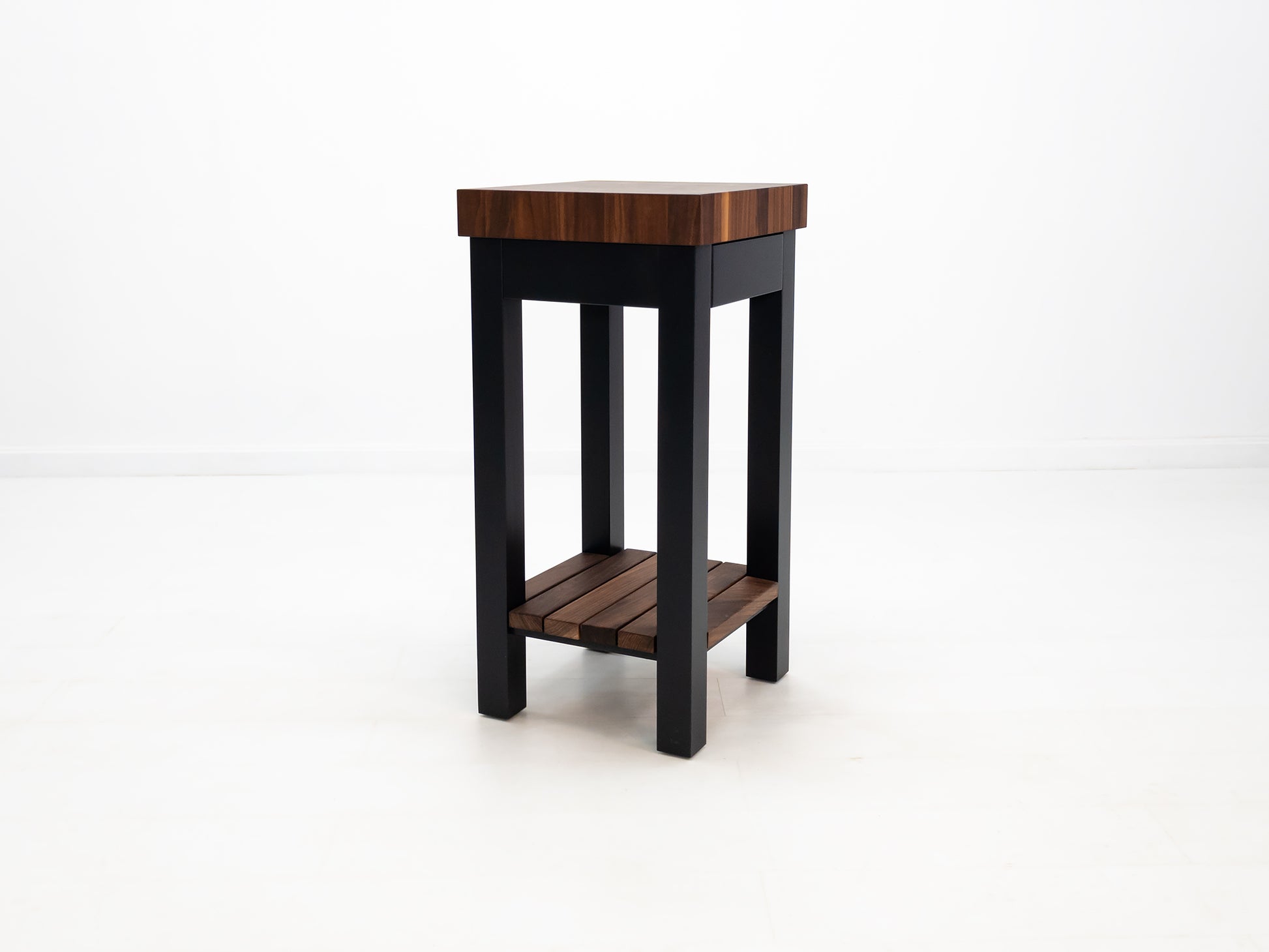 Custom LUCA island with painted base and slatted walnut shelf.