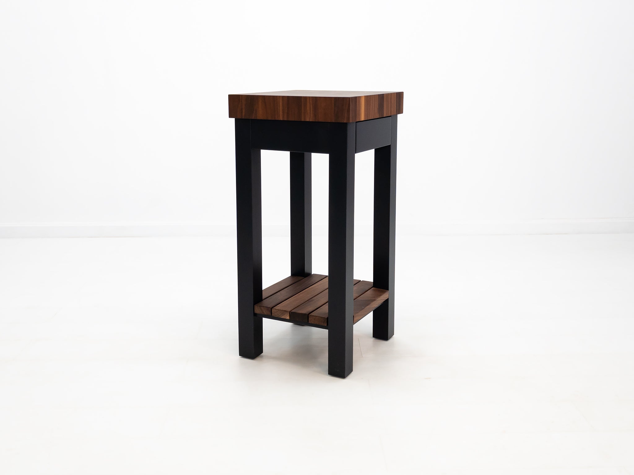 Custom LUCA island with painted base and slatted walnut shelf.
