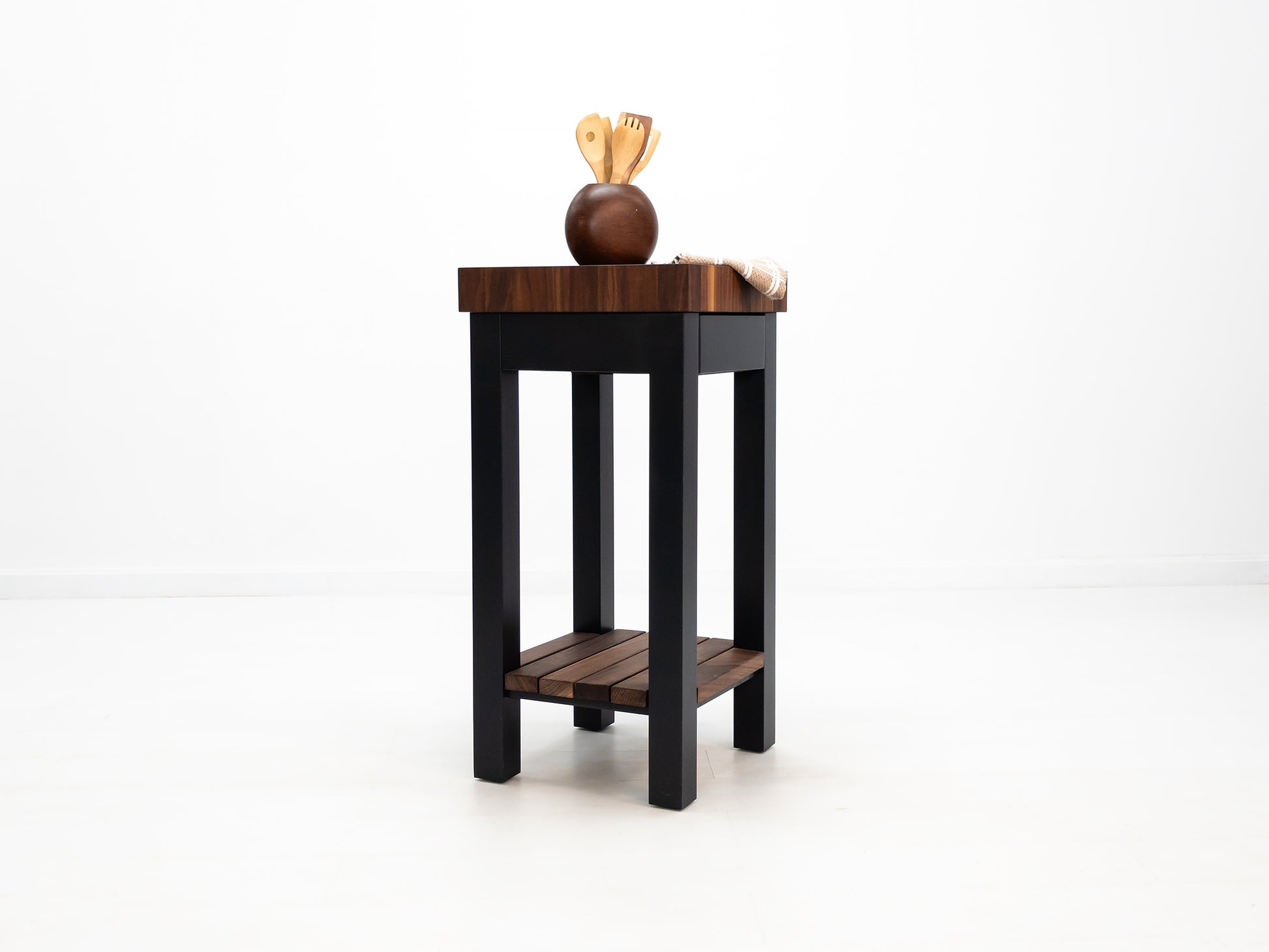 Custom LUCA island with painted base and slatted walnut shelf.