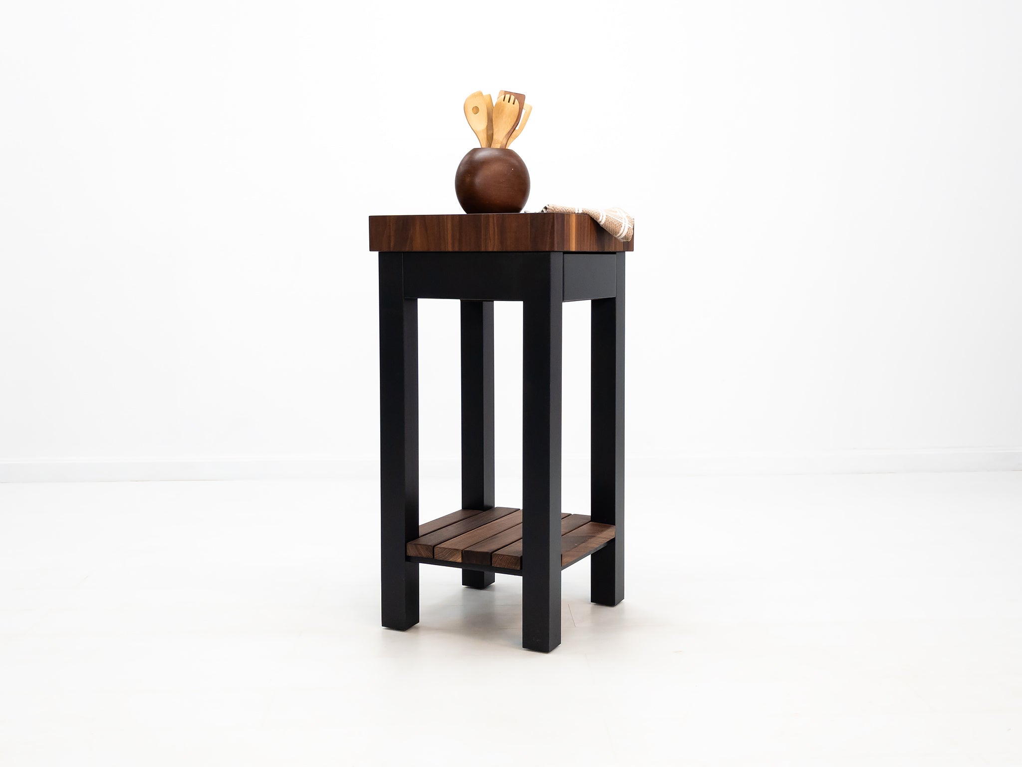 Custom LUCA island with painted base and slatted walnut shelf.