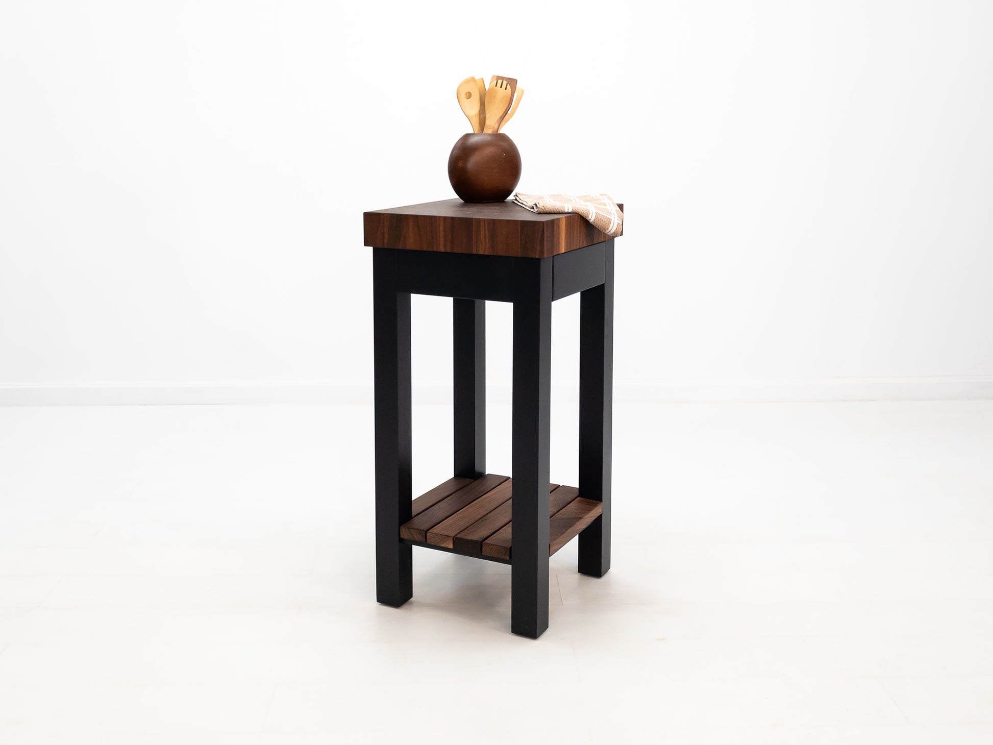 Custom LUCA island with painted base and slatted walnut shelf.