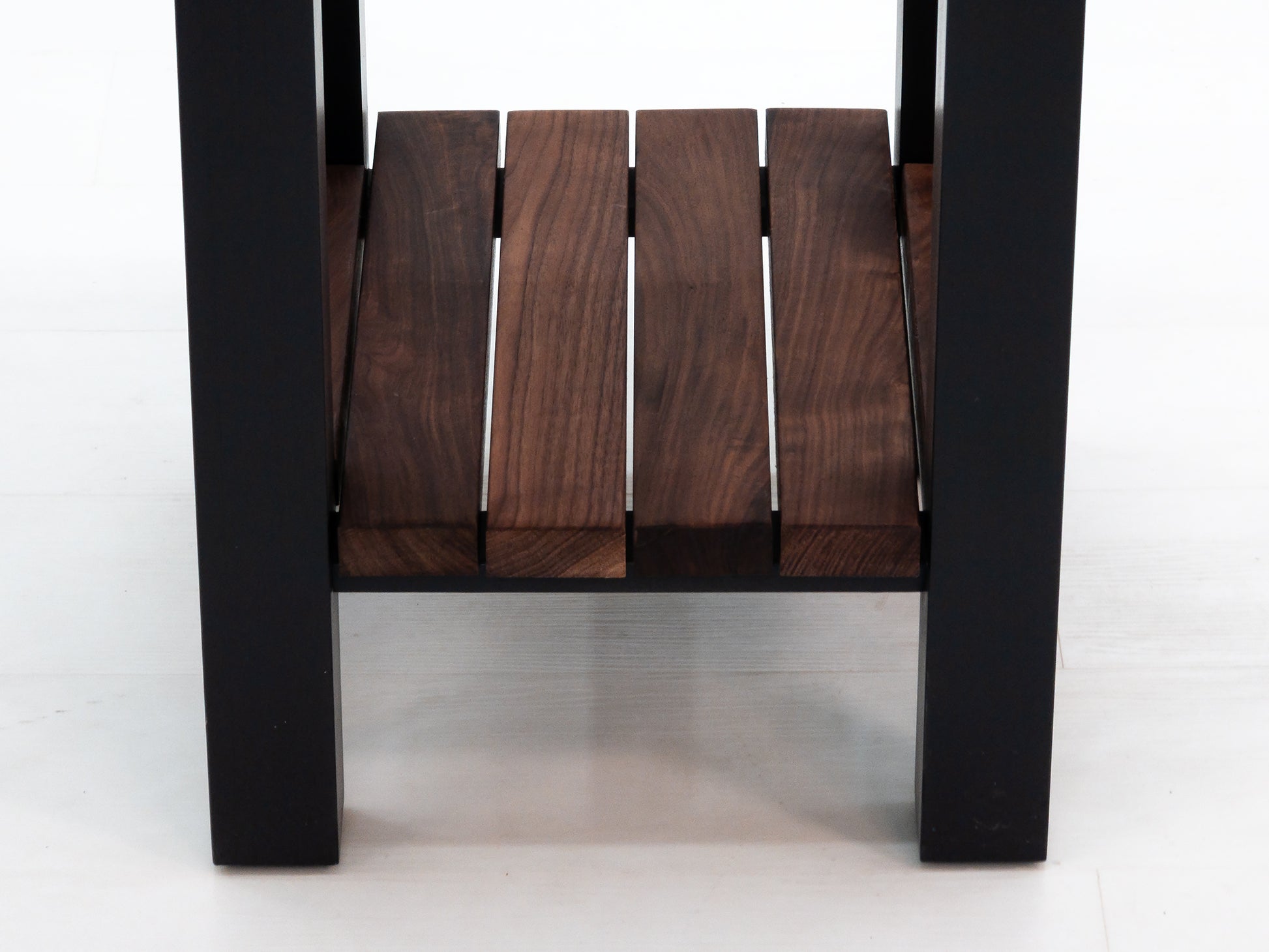 Custom LUCA island with painted base and slatted walnut shelf.