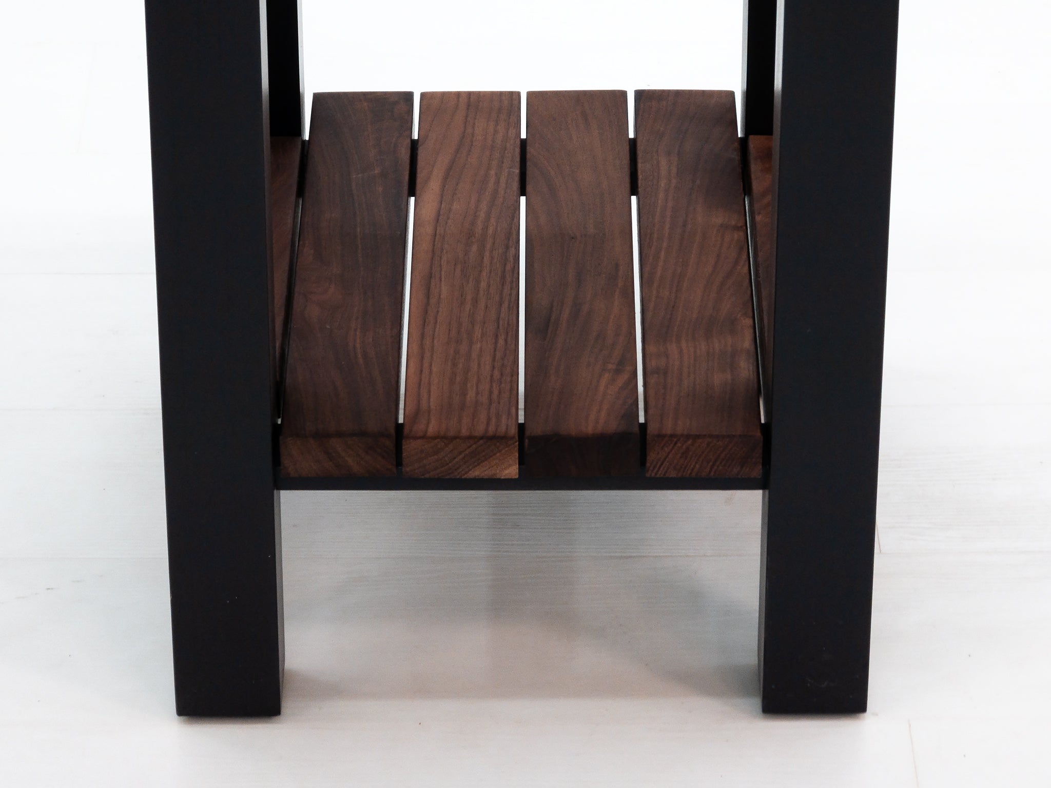 Custom LUCA island with painted base and slatted walnut shelf.