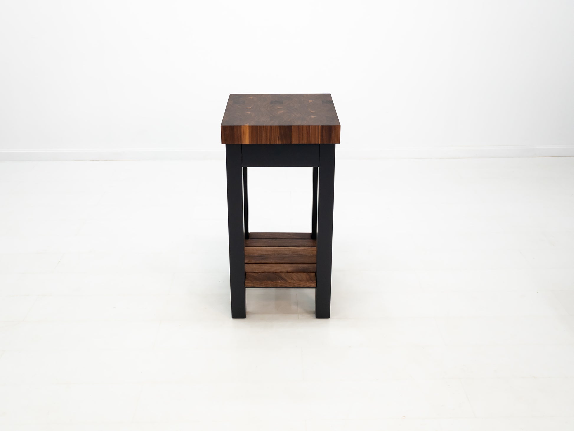 LUCA kitchen island with end-grain walnut butcher block top and slatted shelf.