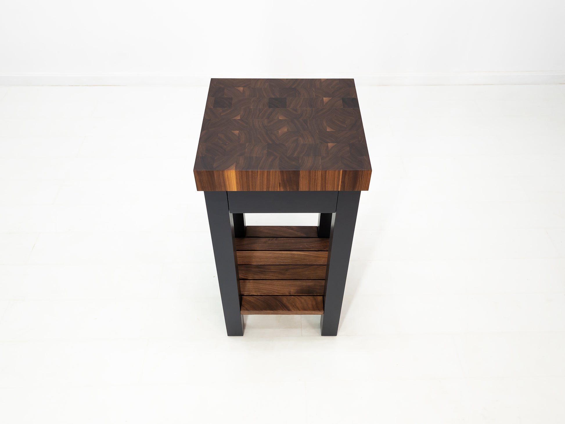 LUCA kitchen island with end-grain walnut butcher block top and slatted shelf.