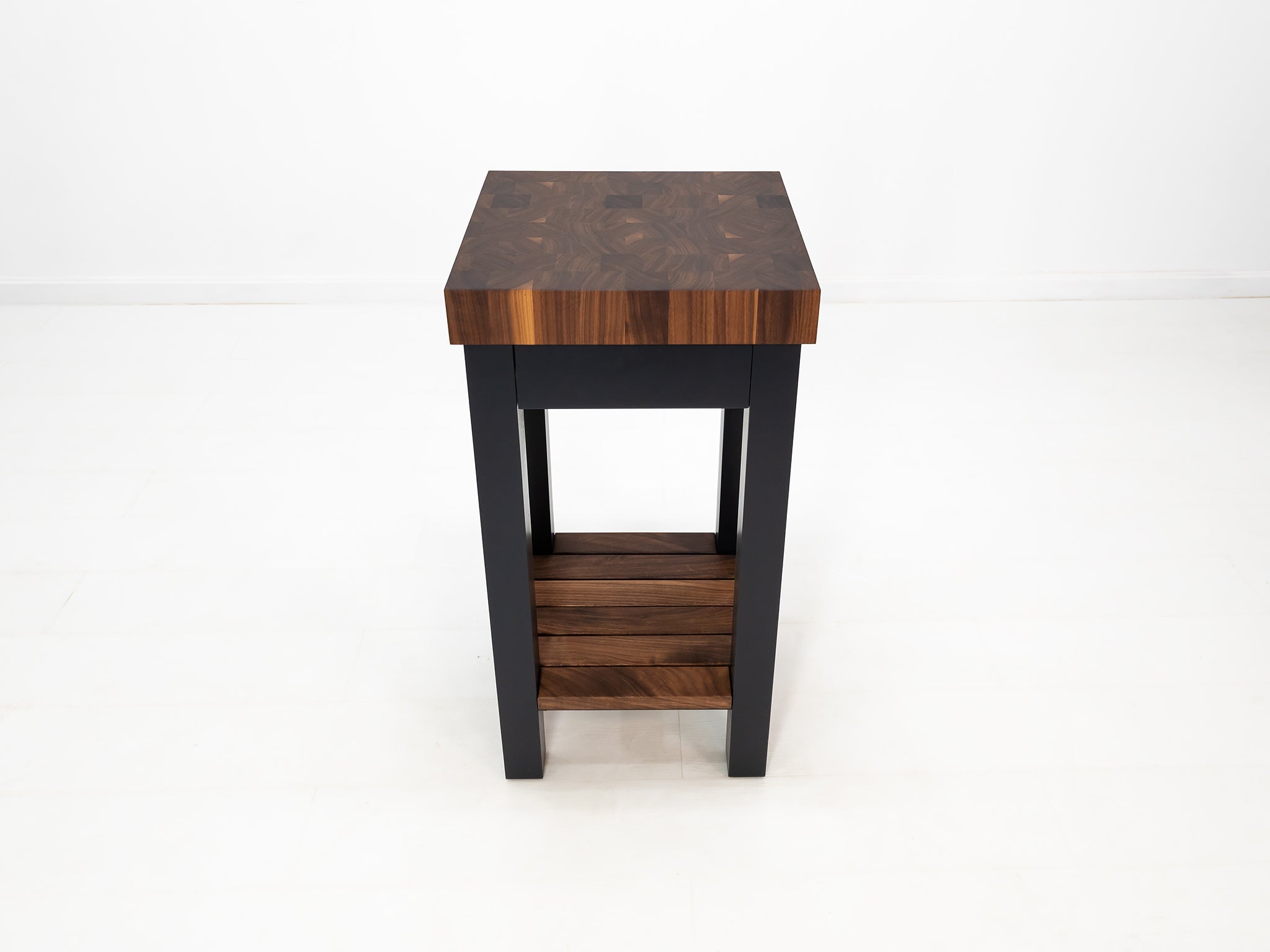 LUCA kitchen island with end-grain walnut butcher block top and slatted shelf.