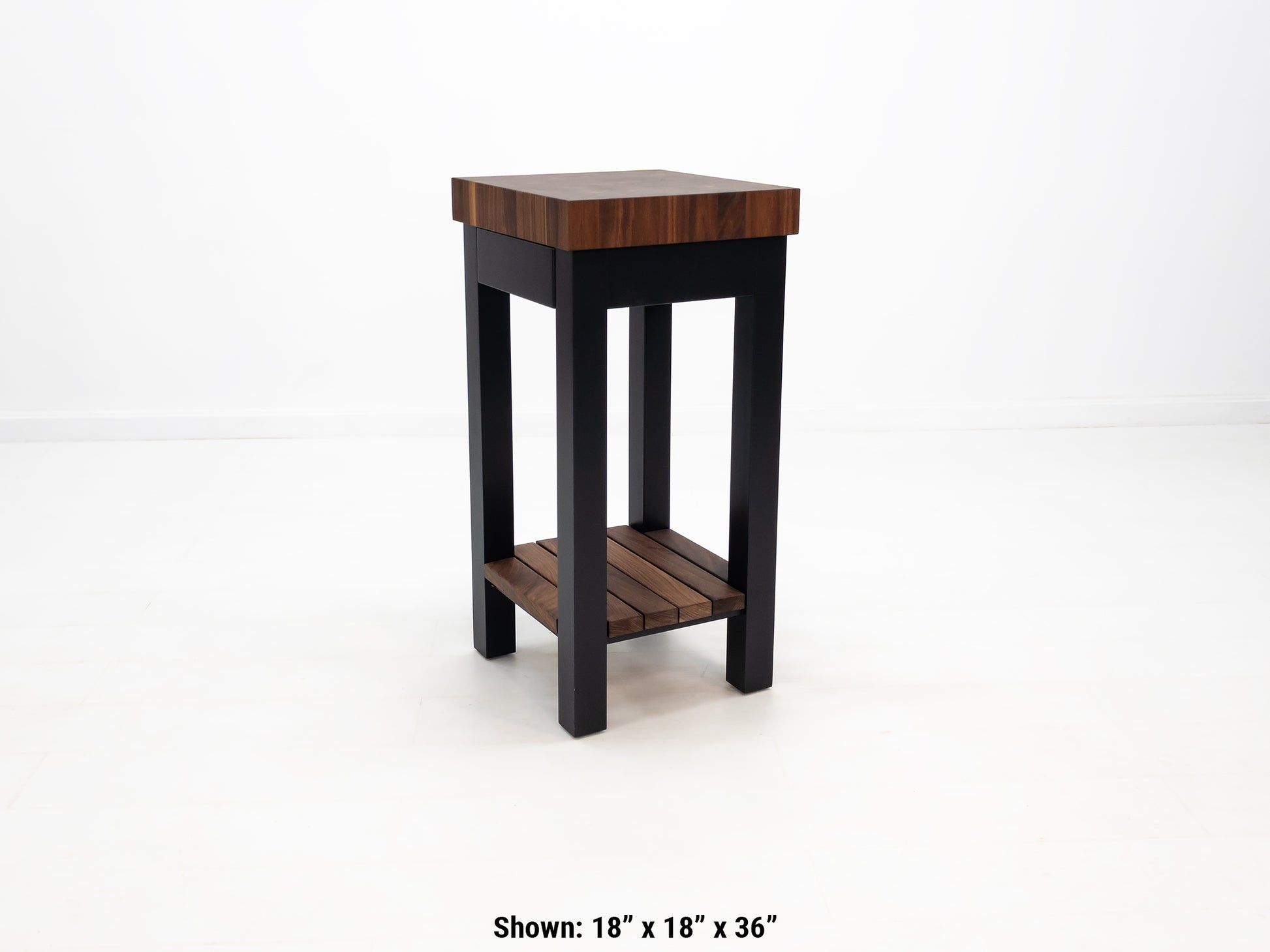 LUCA kitchen island with end-grain walnut butcher block top and slatted shelf.