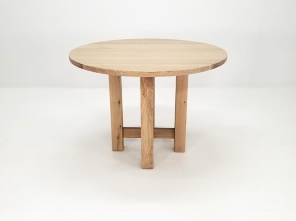 A round white oak dining table.