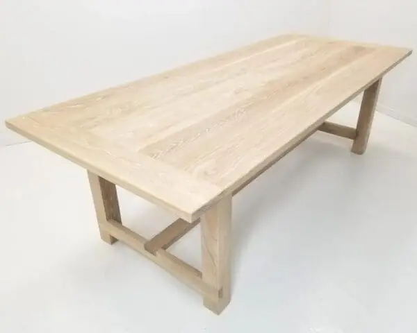 A seawashed white oak trestle dining table.