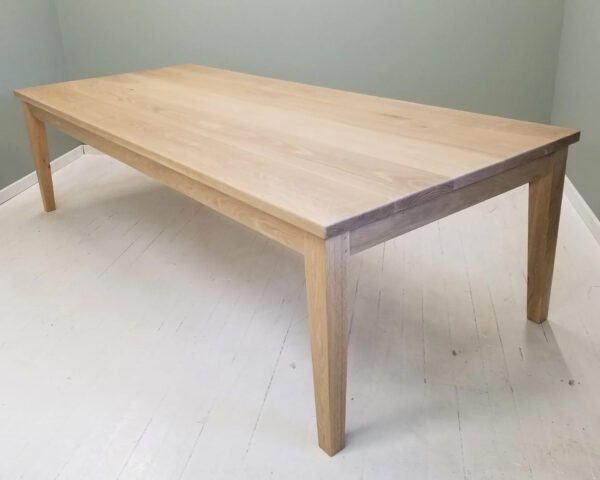 A tapered leg dining table.