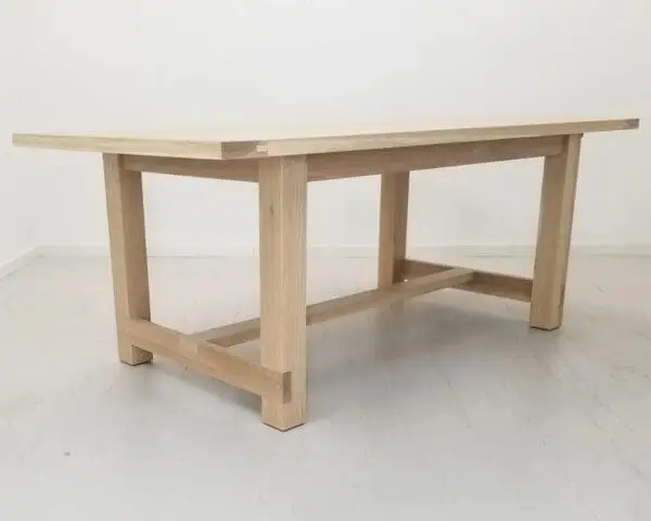 A seawashed white oak trestle dining table.