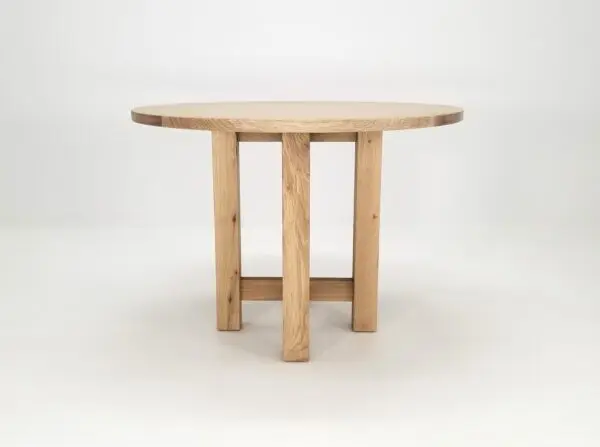 A round white oak dining table.