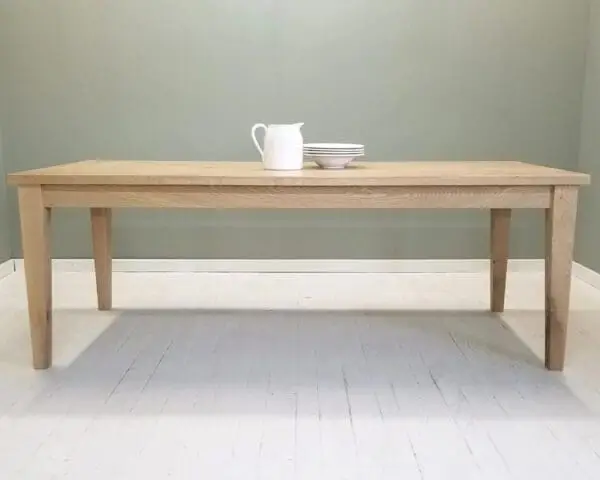 A tapered leg dining table.