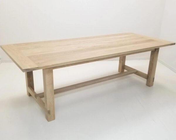 A seawashed white oak trestle dining table.
