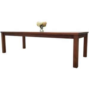 A JONA Beam Leg Dining Table with a vase of flowers.