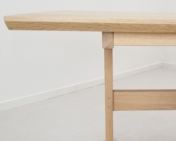 A table with wooden legs and top.