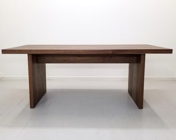 A 2 inch thick solid walnut dining table.