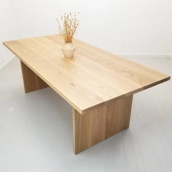 Panel dining table with vase on top.
