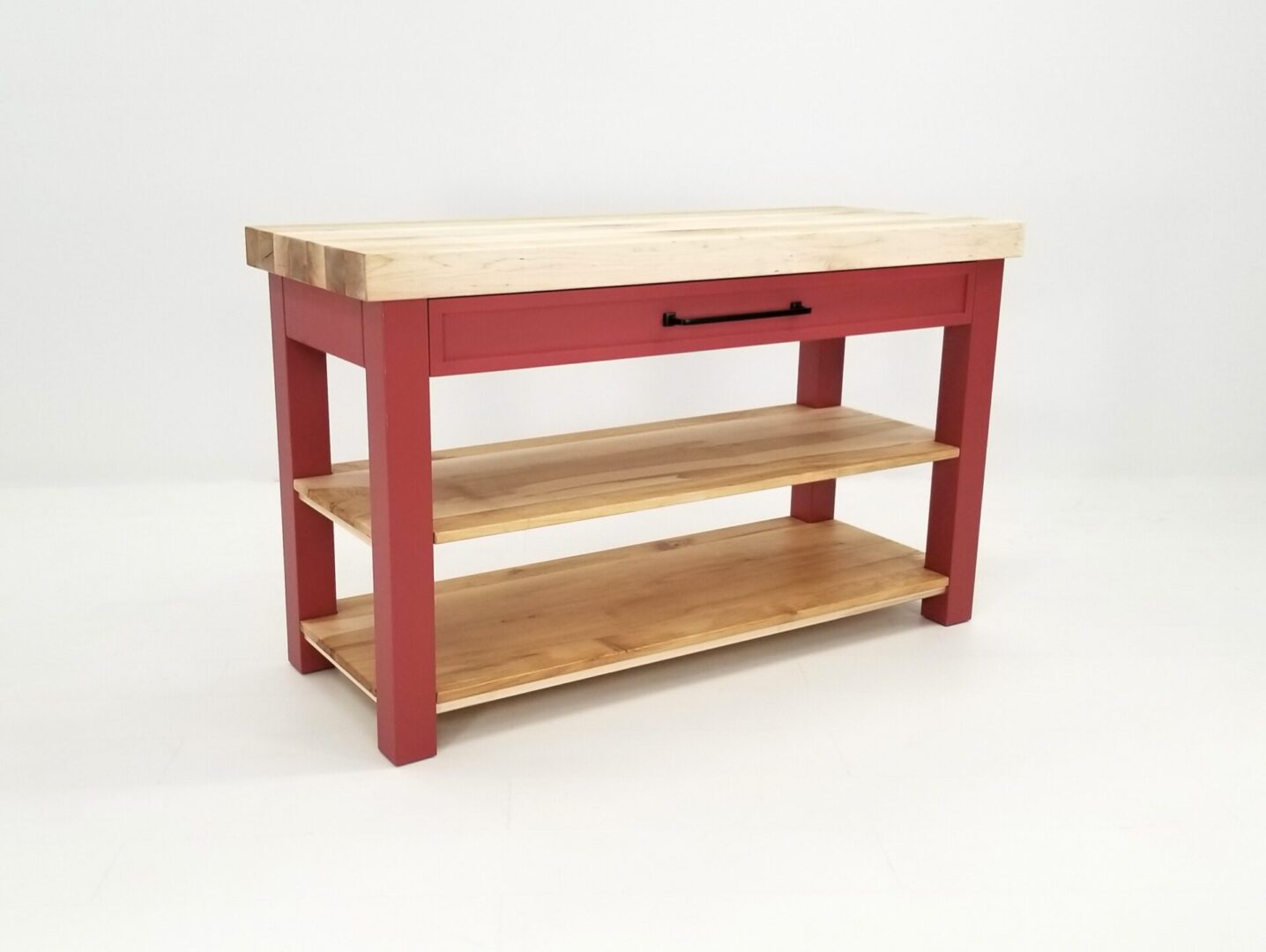 A red kitchen table with a CHEF Custom Maple Butcher Block Cart.