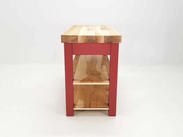 A red kitchen table with a CHEF Custom Maple Butcher Block Cart top.