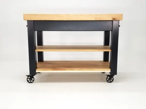 A black CHEF Custom Maple Butcher Block Cart on wheels with a butcher block top.