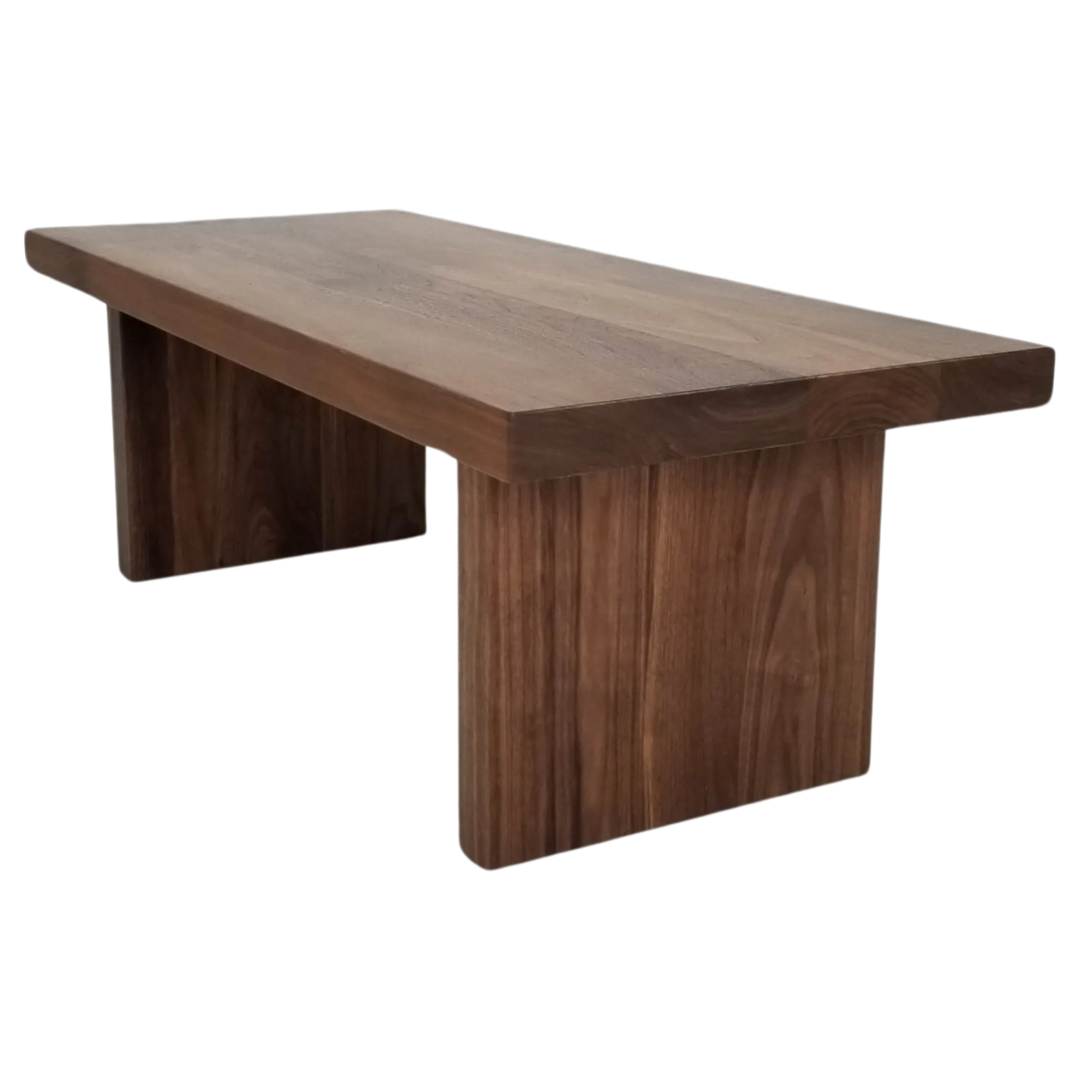 A walnut panel coffee table.