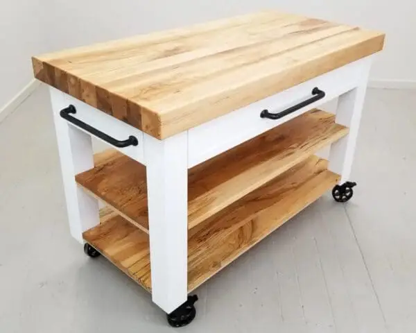 A butcher block cart in white.